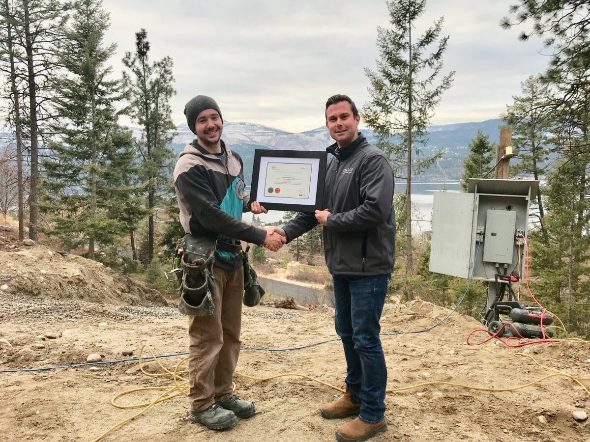 Chriscan owner Jim Kitchen presents Damian Findley with his Journeyman certificate for carpentry