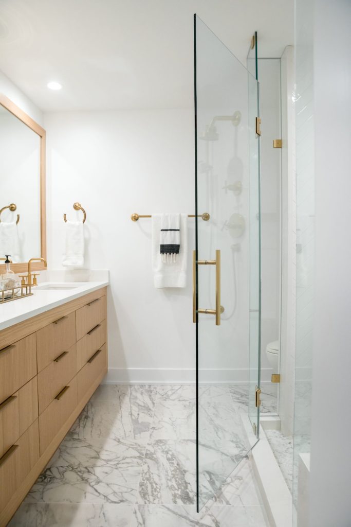 Bathroom vanity and glass door shower in lakefront Okanagan home.