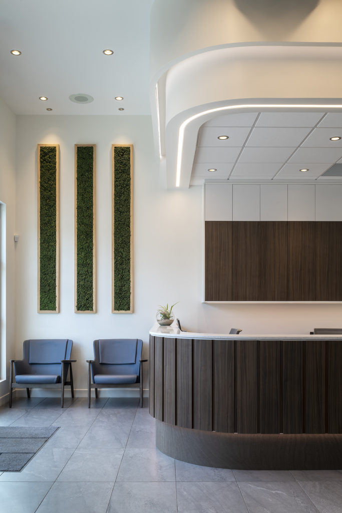 Part of reception area with waiting area to the left at Quail Ridge Dental in Kelowna, BC.