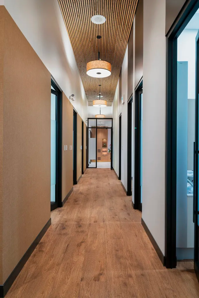 a modern hallway between treatment rooms at Glenmore Dental